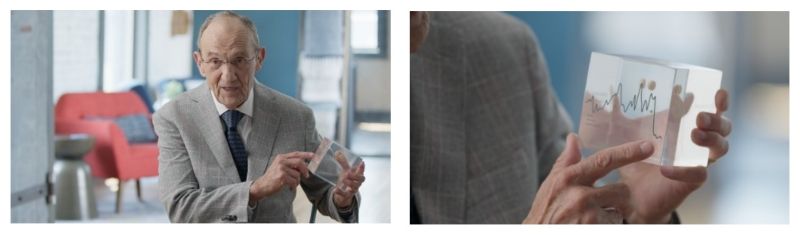 Dr. Gaydos with vaccine tablet in Lucite